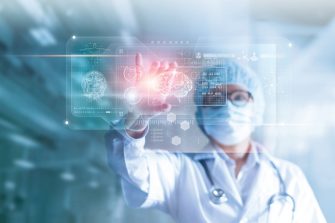 a clinician looking at a virtual picture of a brain