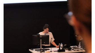 a woman presenting in Digital Health Week 2026