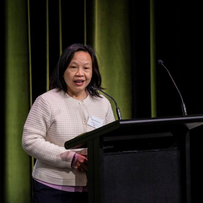 woman speaking at podium 