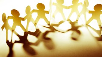 Team of paper doll people
