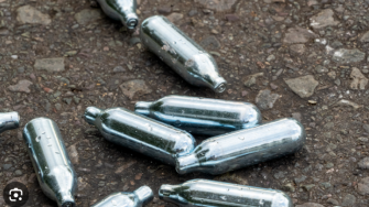 Image of nitrous oxide cannisters on the ground