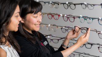 Photograph of women browsing for glasses