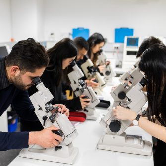 Photograph of science students using microscopes