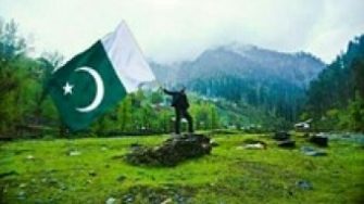 Pakistan flag and countryside