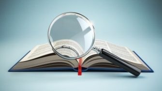 search book with magnifying glass