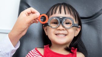 Asian Little Girl Doing Eyes Examination at An Optical Shop