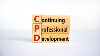 CPD, continuing professional development symbol. Wooden blocks with words CPD, continuing professional development on beautiful white background. Business, CPD concept.