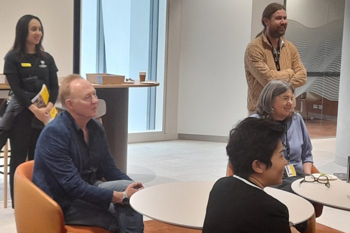Prof James Wood, Prof Tony Butler, Prof Rebecca Ivers and Prof Xiaoqi Feng listen to a speaker in The Heart, HTH