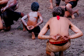 Indigenous Australians dancing in their native body paint
