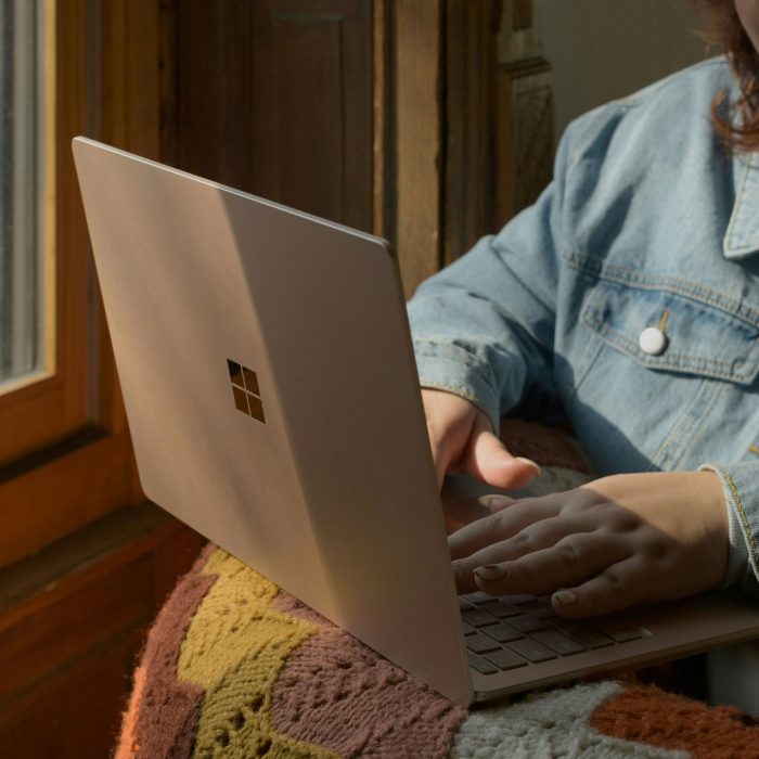 Person using Microsoft Surface laptop