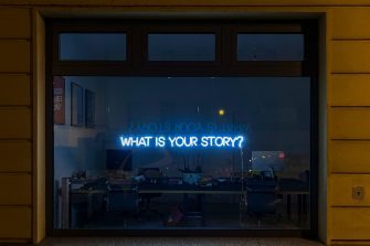 What is your story in neon lights in a window