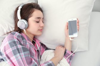 Woman sleeping with headphones in