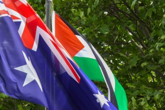Palestinian Flag and Australian flag move in the breeze beside one another