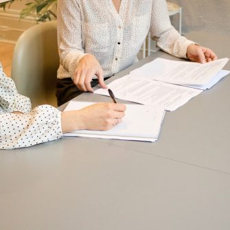 Business women looking at documents