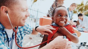 Doctor Assessing Young Child 