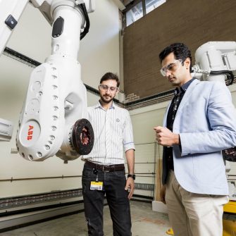 Civil Engineers examine 3D concrete printer
