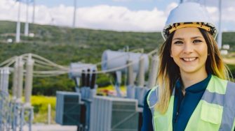 Female Student on Site Wearing Hi Vis & Hard Hat