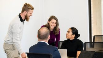 A group of policy leadership professionals in a meeting