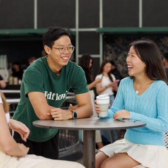 Students talking with coffee at a table