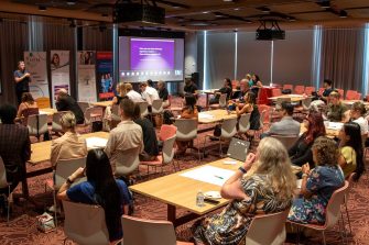Attendees engaged in reflection on the question "Have you ever been told your experience matters — then not been asked for it?" during the Rare Power interactive session.