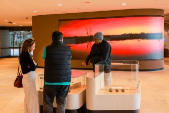 Warren Foster (Senior) (Yuin-Djirringanj), with Exhibition Opening guests. Photo by Katherine Griffiths.
