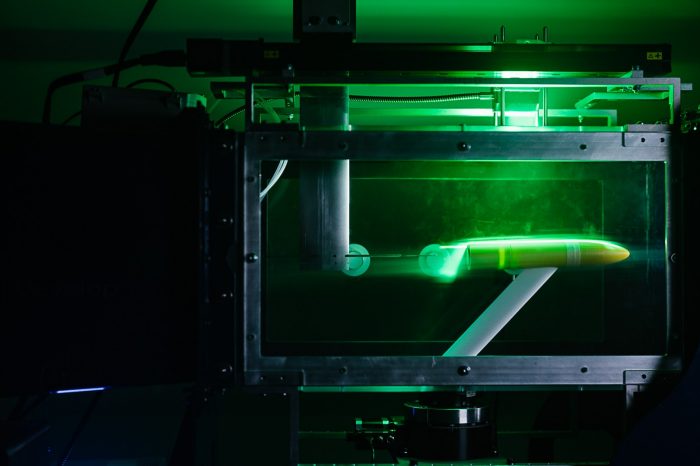 Model aircraft mounted in a wind tunnel for aerodynamic testing