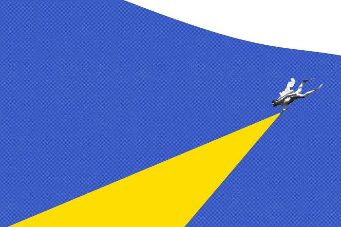 Image of newsprint diver in indigo water with a torch. The beam of light is bright UNSW yellow.