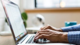 Person typing on a laptop