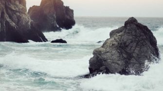 Rocks protruding from rough seas