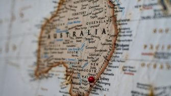 Closeup of a map of Australia with a red pin in Sydney