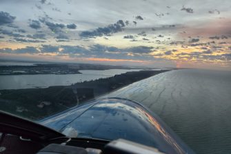 Coastal sunrise from light aircraft