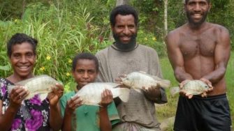 People holding fish