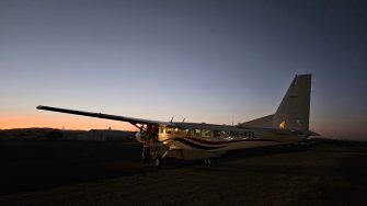 Light aircraft before dawn