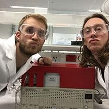 Two students in lab pulling faces