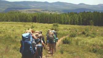 Backpacker walking on a trail