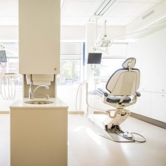 Dentist surgery with two chairs facing a window