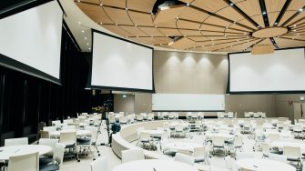 Events room white and circular with screens