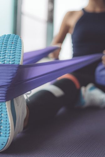 Man writing goals in notebook ideas and enjoying nature in wooded area