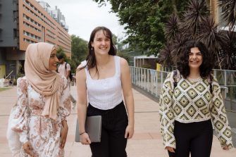 A group of student looking at the camera and smiling.