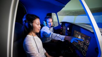 A student and educator in the UNSW flight simulator