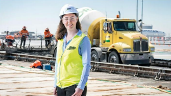 Woman wearing hard hat on construction site
