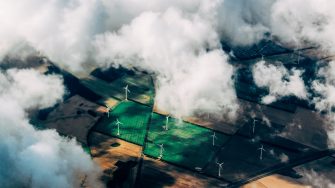 drone image of wind farm through the clouds