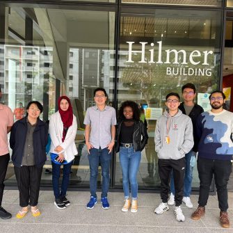 Group photo of students from the School of Chemistry standing in front of the Hilmer Building