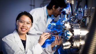 Scientists calibrating science machines