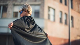 Child dressed in superhero costume