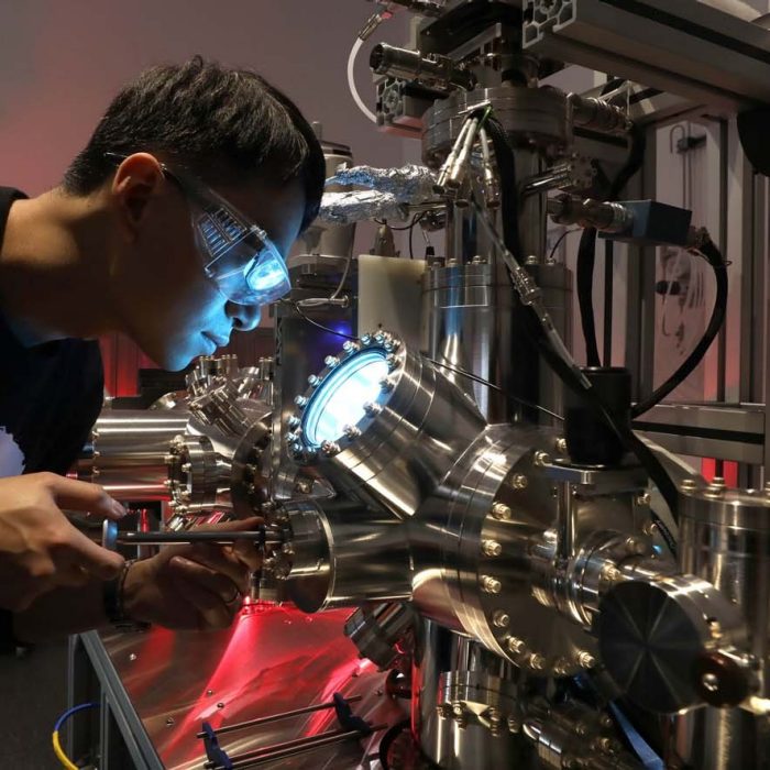 Man using scanning probe microscope equipment