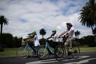 Students riding bikes in Centennial Park