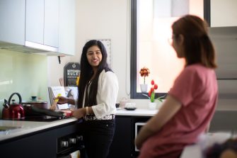 Students cooking in kitchen of student accommodation