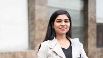 Studious student carrying books