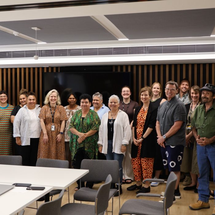 The Dharriwaa Elders Group and UNSW colleagues are smiling for the camera